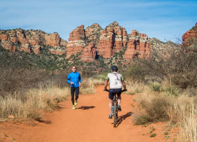 Jogger and Mountain Biker on Bell Rock Pathway, Sedona, Arizona, with Panoramic Views