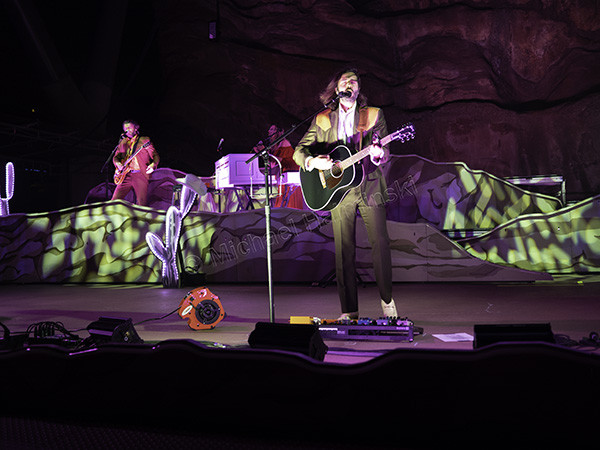 Captivating center stage shot of Lord Huron's singer and songwriter Ben Schneider performing at Red Rocks Amphitheater.