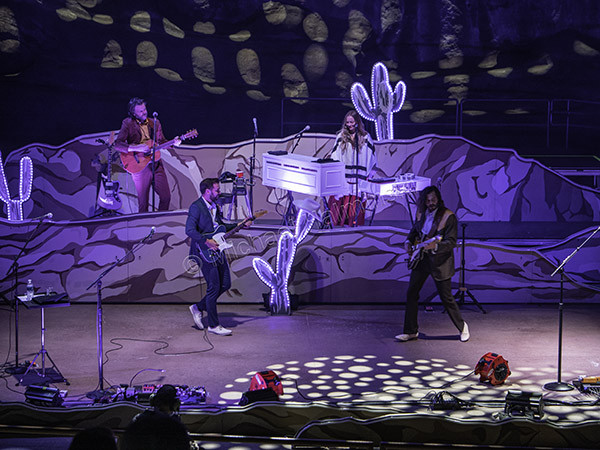 Image highlighting Brandon Walters and Misty Boyce performing with Lord Huron at Red Rocks, showcasing their instrumental and vocal talents.