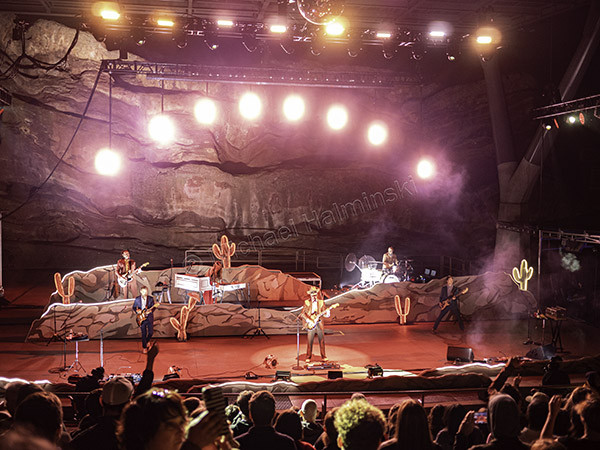 Image capturing the dynamic lighting effects during the Lord Huron concert at Red Rocks Amphitheater, showcasing the visual spectacle.