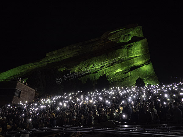 Audience using smartphone flashlights for an encore call at the Lord Huron Red Rocks concert, a modern take on the traditional lighter encore.