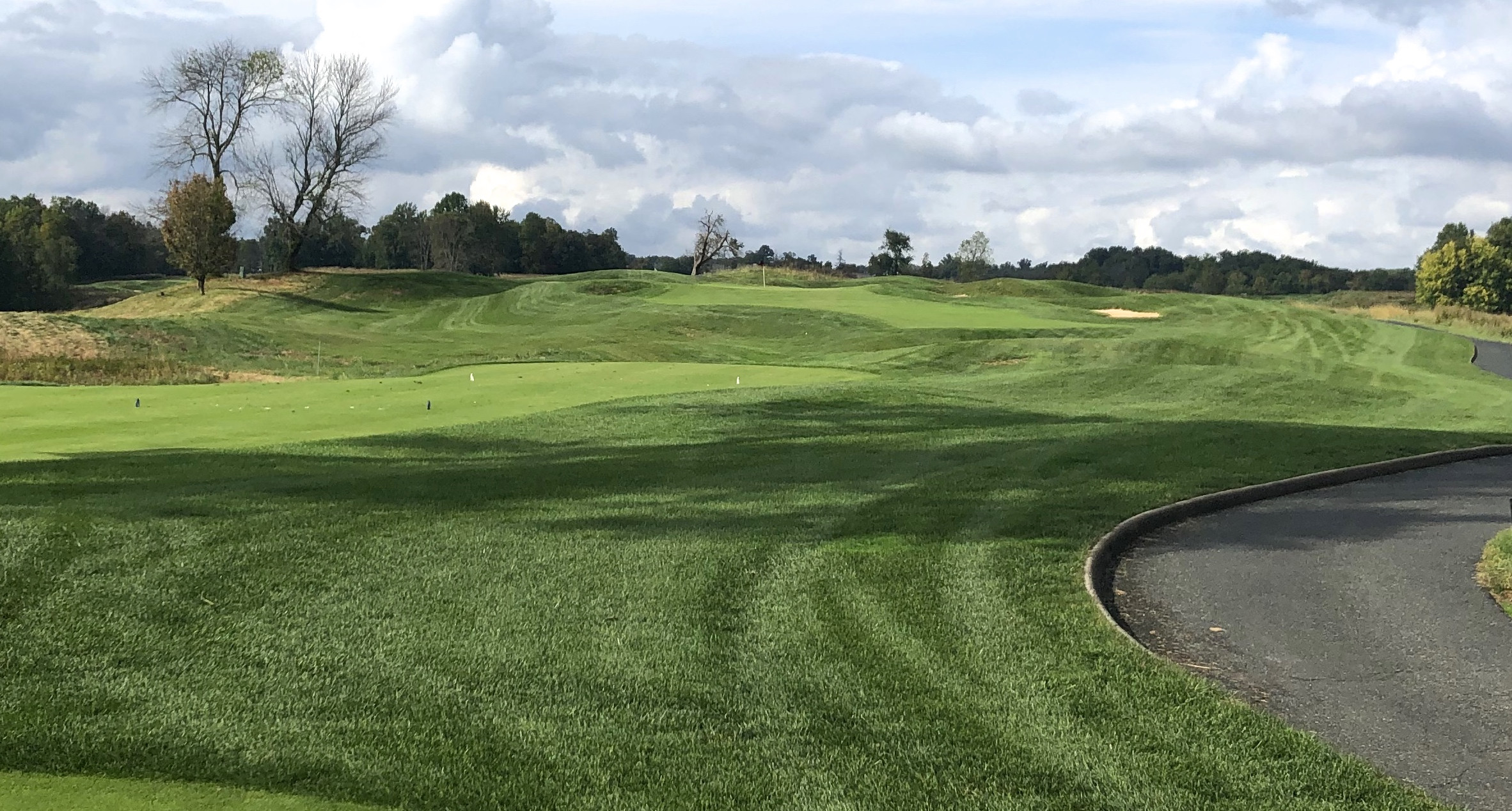 Bulle Rock Golf's par 3 7th hole, a longer par three with a multi-tiered green defended by strategic bunkering.