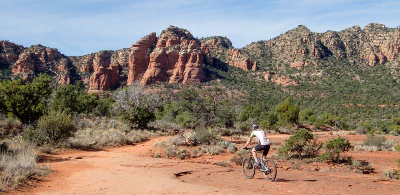 Mountain Biker on the Return Journey of Bell Rock Pathway, Sedona, Arizona, Discovering New Vistas