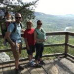 Family enjoying the panoramic vista from Vista Rock at Chimney Rock State Park