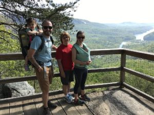 Family enjoying the panoramic vista from Vista Rock at Chimney Rock State Park