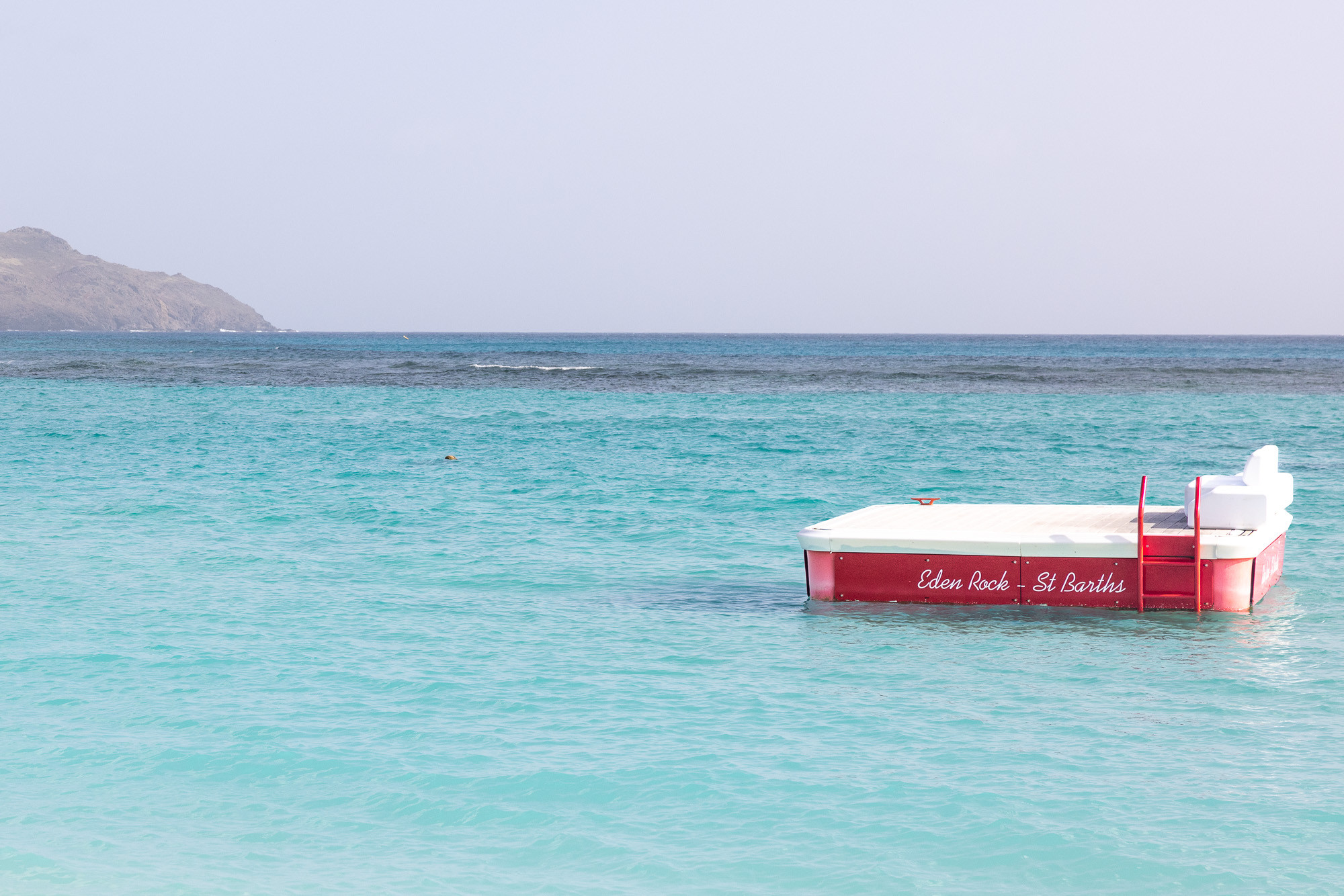 Eden Rock St Barths floating platform in the ocean for sunbathing and relaxation.