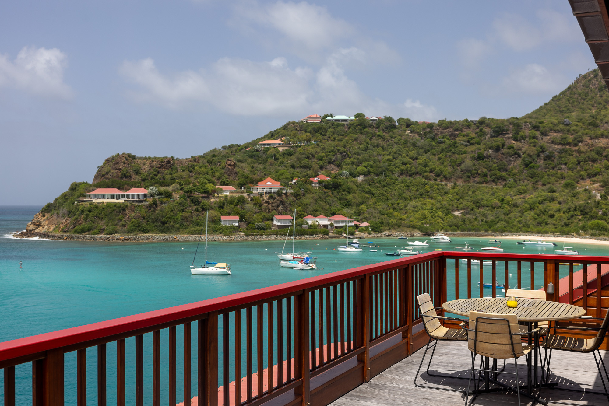 Close up of Eden Rock St Barths suite exterior with stone and wood details.