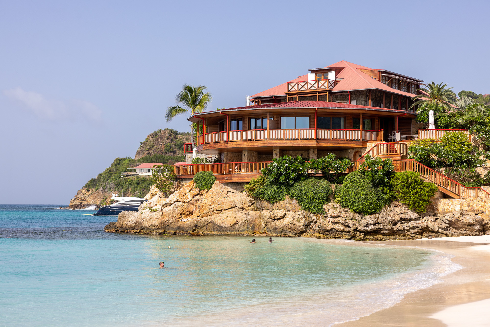 Eden Rock St Barths bar area with stylish décor and ocean backdrop.