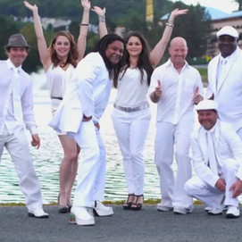 Cheeseballs band performing pop, funk, and dance music at the Rock the Dock waterfront concert