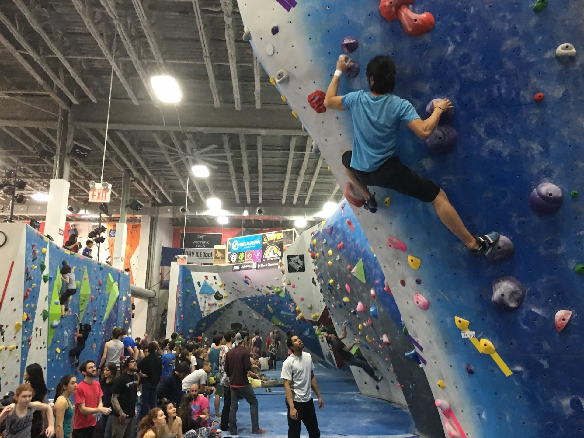 Climbers at The Cliffs Long Island City, a top rock climbing gym in NYC.