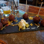 Coconut shrimp and bacon cheeseburger lollipops at Red Rock Tap + Grill