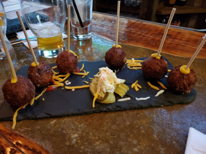 Coconut shrimp and bacon cheeseburger lollipops at Red Rock Tap + Grill