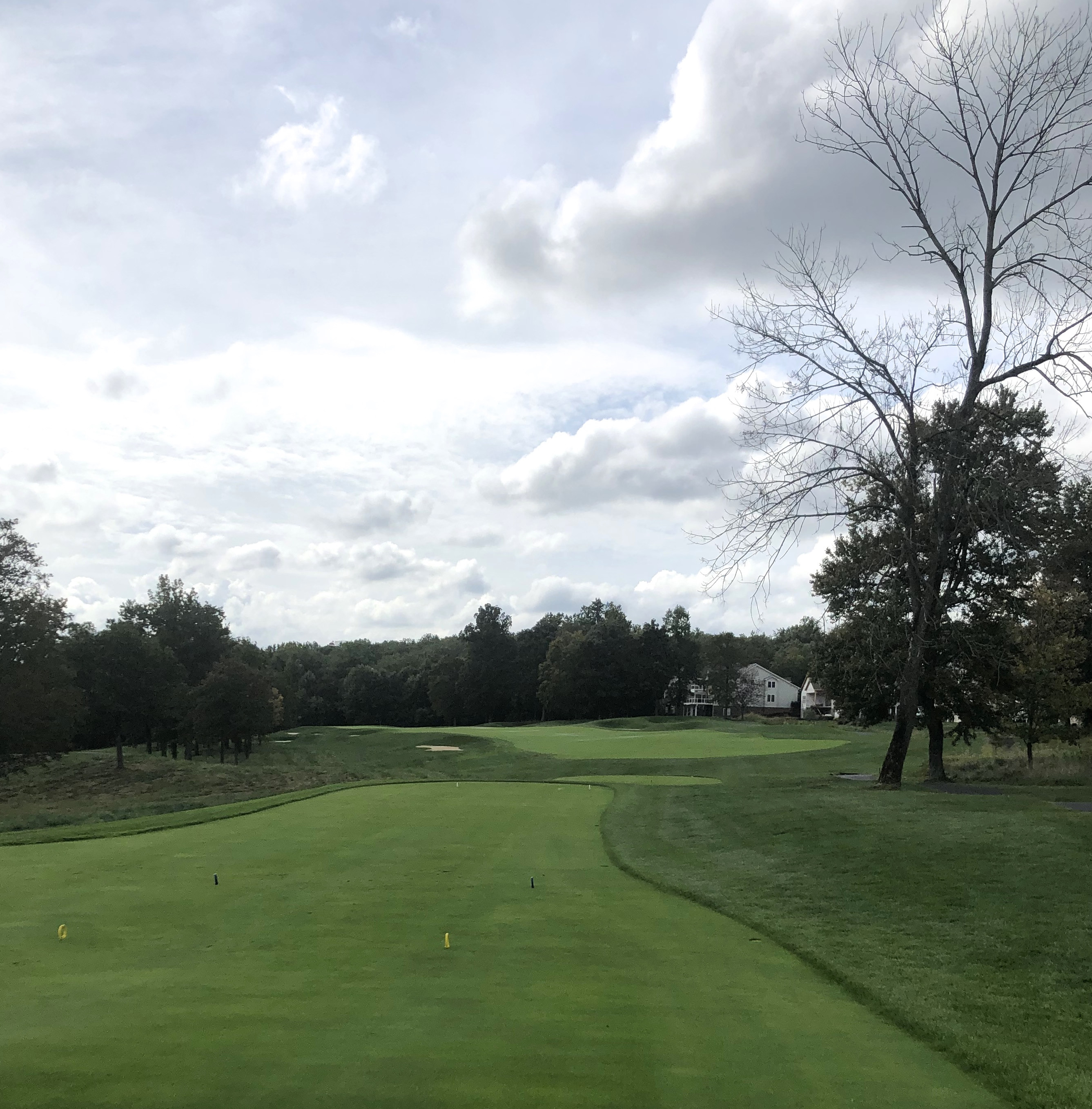 The par 4 1st hole at Bulle Rock Golf Course showcases Pete Dye's strategic bunker placement and undulating fairway.