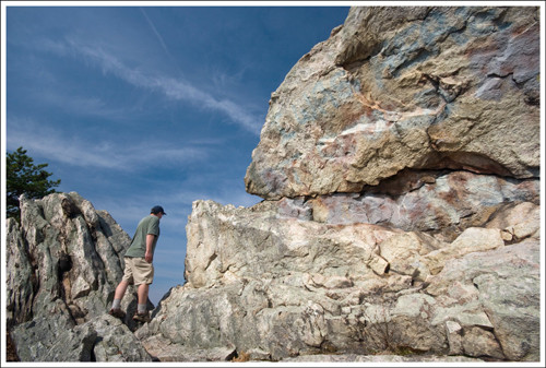 Hiker enjoying the view from Buzzard Rock overlook