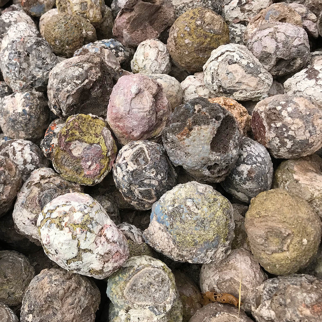 A pile of Arizona geodes, showcasing their rough exteriors and potential for crystal-filled interiors