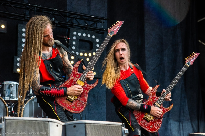 Jonas Jarlsby and Tim Öhrström of Avatar performing at Blue Ridge Rock Festival Day 3. The guitarists are playing their unique folding microphones on stage.