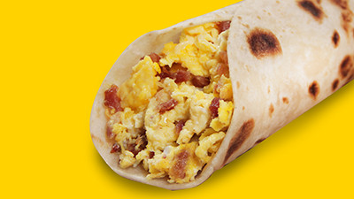 Classic bacon and egg breakfast taco from Taco Palenque Round Rock, highlighting crispy bacon and fluffy scrambled eggs.