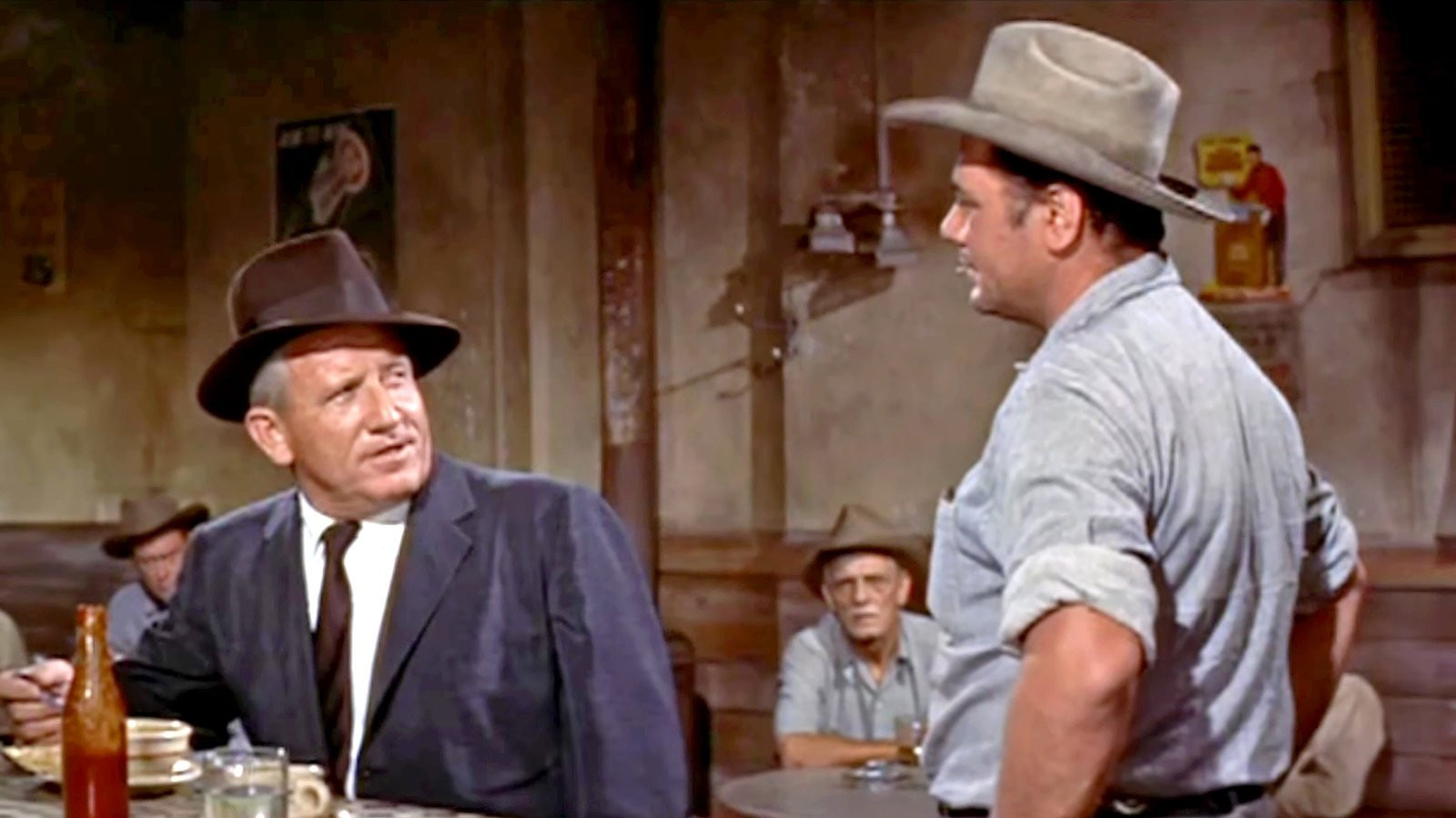 Dialogue scene between Spencer Tracy and Walter Brennan in 'Bad Day at Black Rock', highlighting the film's sharp script.