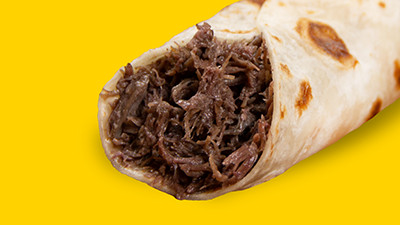 Smaller portion barbacoa jr. breakfast taco at Taco Palenque Round Rock, offering the same great flavor in a lighter serving.