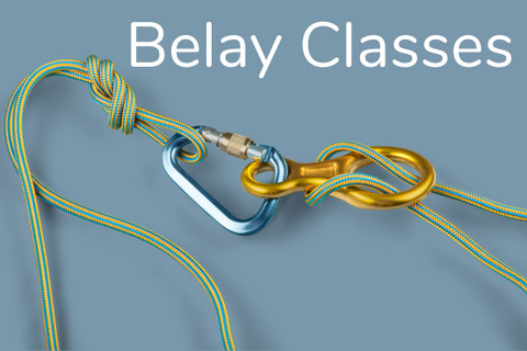People learning belay techniques in a rock climbing class