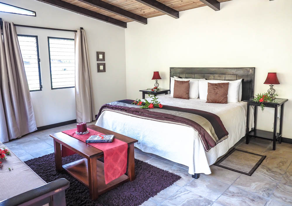 Large bed in a spacious deluxe cabin at Black Rock Lodge Belize