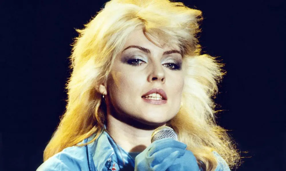 Debbie Harry of Blondie performing live, showcasing her iconic look and stage presence