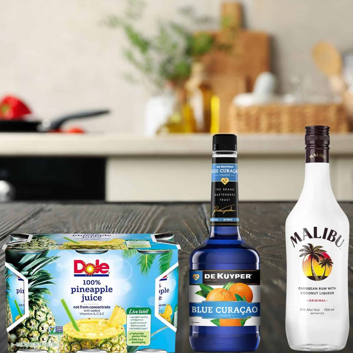 a counter with blue curacao, coconut rum, and pineapple juice. 