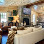 Boston Blend Mosaic stone fireplace paired with oak wood beams for a classic lodge interior