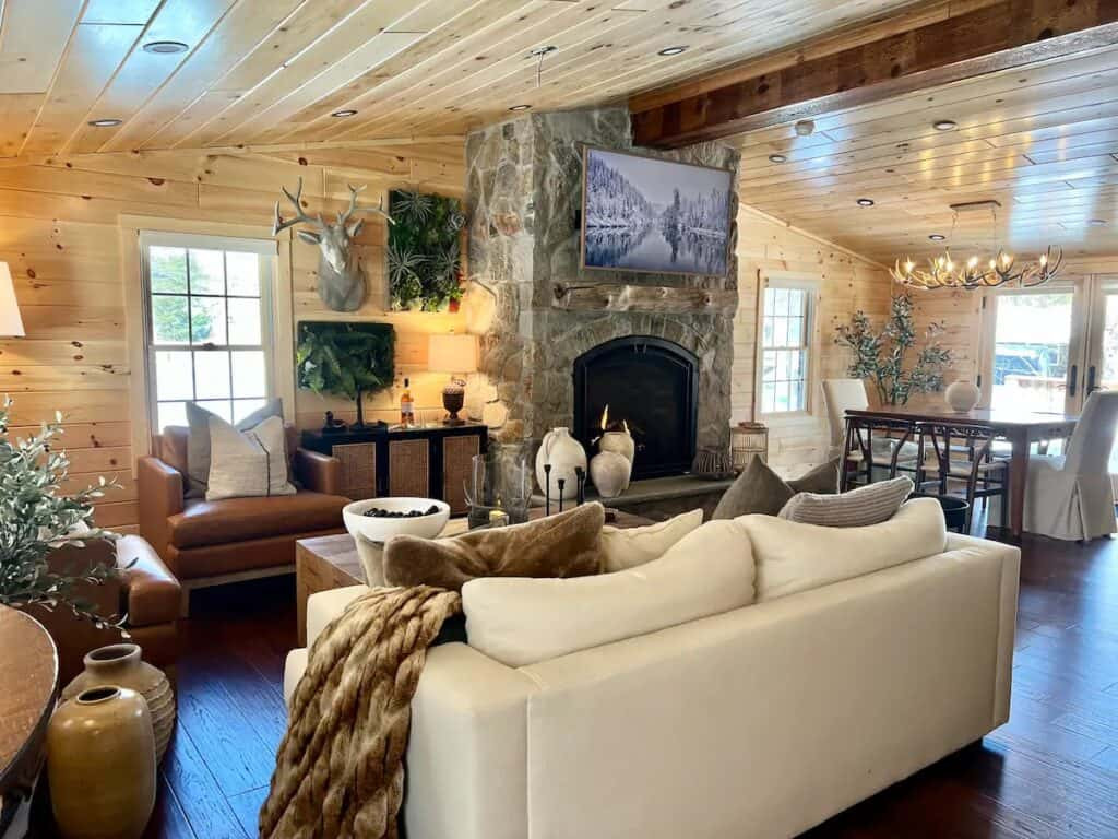 Boston Blend Mosaic stone fireplace paired with oak wood beams for a classic lodge interior