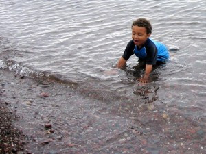 Taking a dunk and rock picking at Black River Harbor