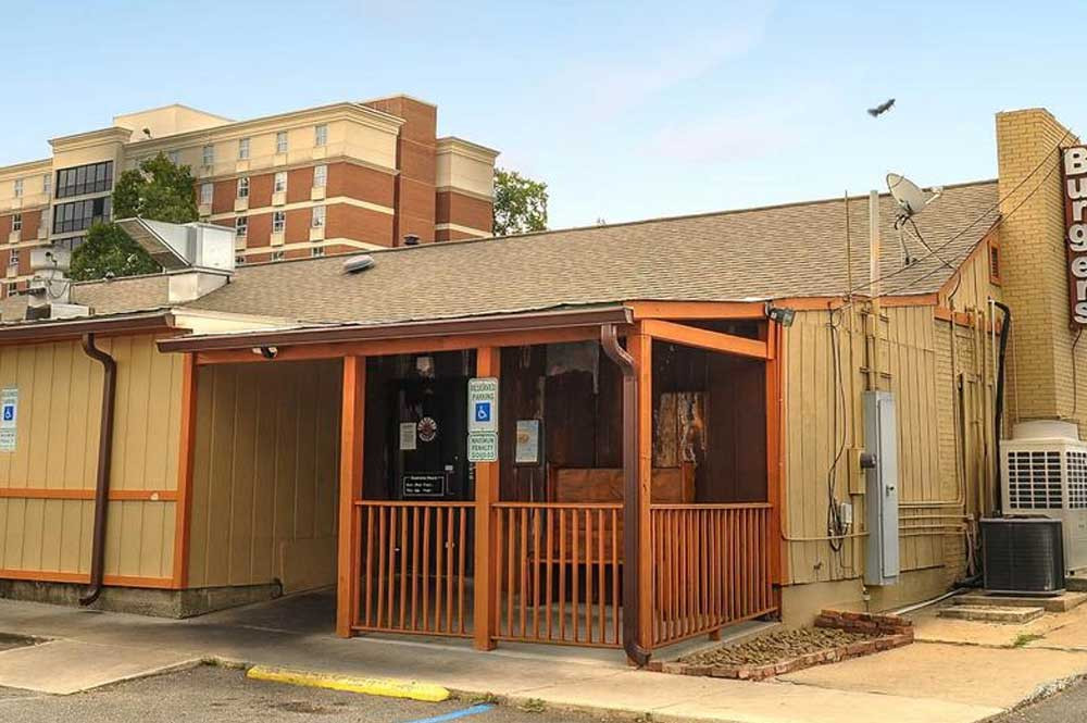 Patrons enjoying burgers at Burgers and Barley, a popular casual restaurant in Rock Hill