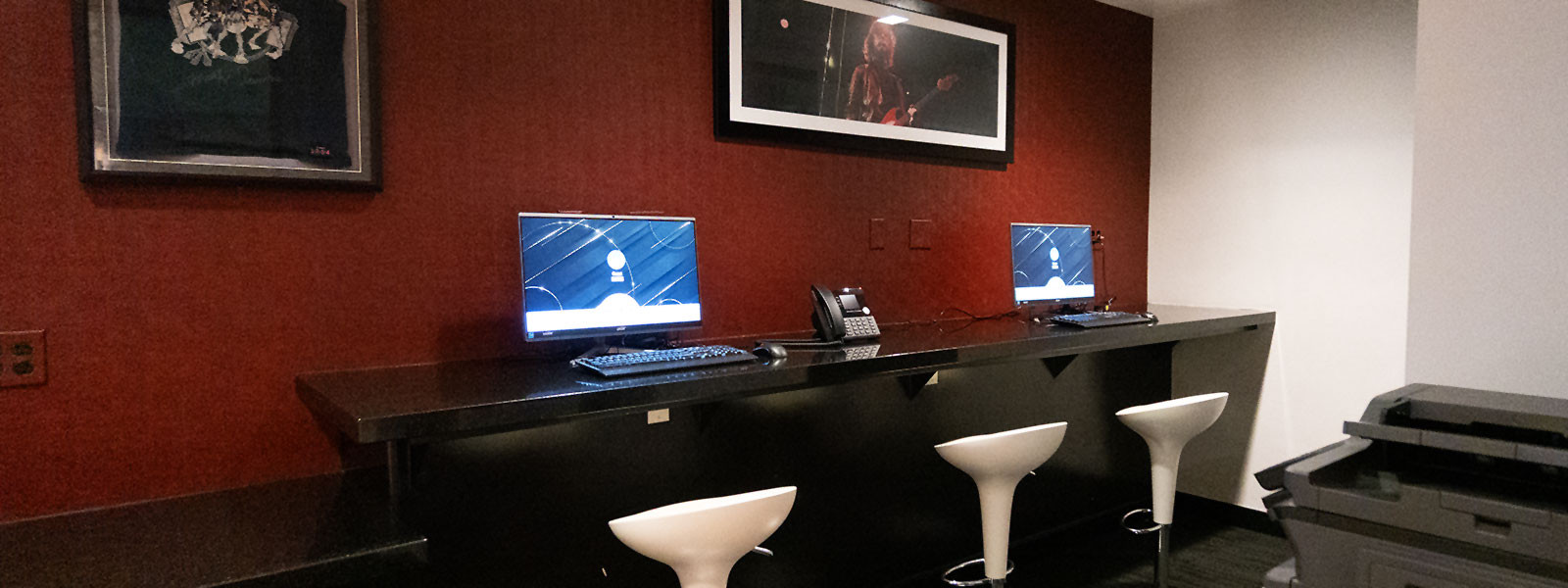 The Business Center at the Hard Rock Hotel San Diego with comfortable seating and computers.