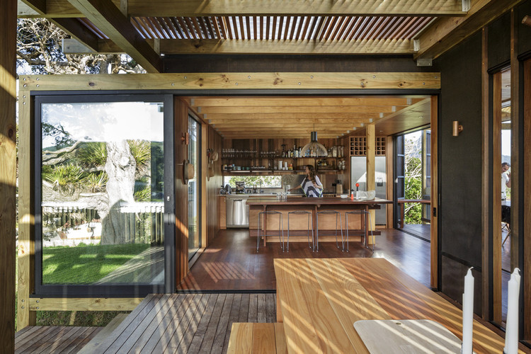 Interior kitchen space in Castle Rock Beach House showcasing wooden beams and natural materials, reflecting beach house design principles