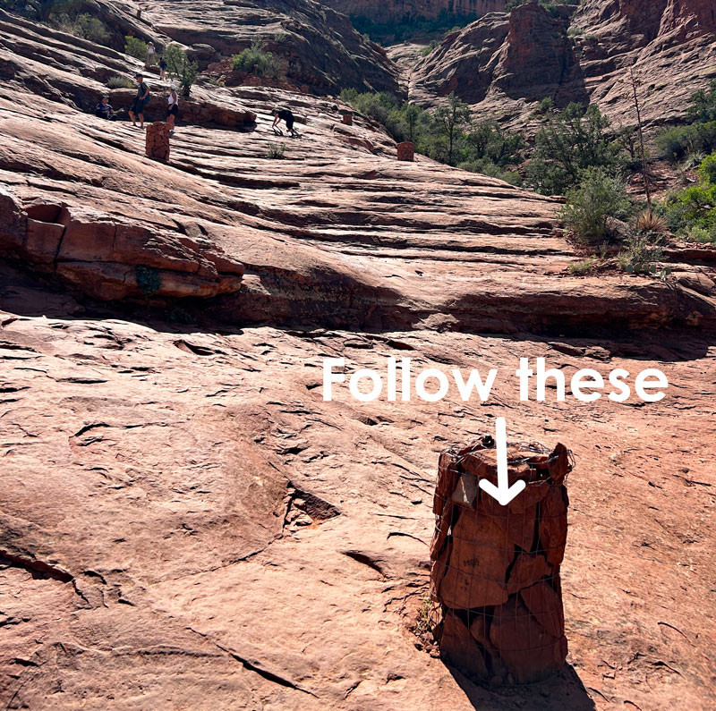 Navigating the Cathedral Rock hiking trail in Sedona with the help of rock cairns.