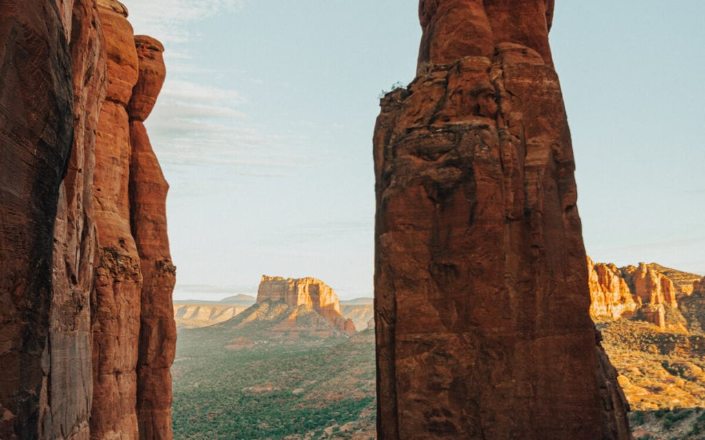 Cathedral Rock Trail at sunset, showcasing the iconic rock formation bathed in the warm hues of the setting sun.