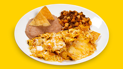 Authentic chilaquiles breakfast plate at Taco Palenque Round Rock, a classic Mexican dish with tortilla chips and salsa.