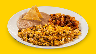 Authentic chorizo and egg breakfast plate at Taco Palenque Round Rock, highlighting Mexican chorizo and scrambled eggs.