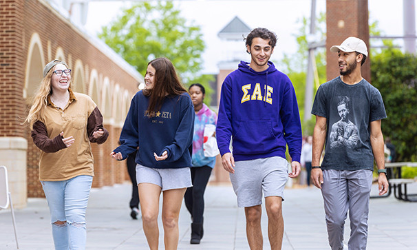 Undergraduate students walking in front of DiGs building on Winthrop University campus