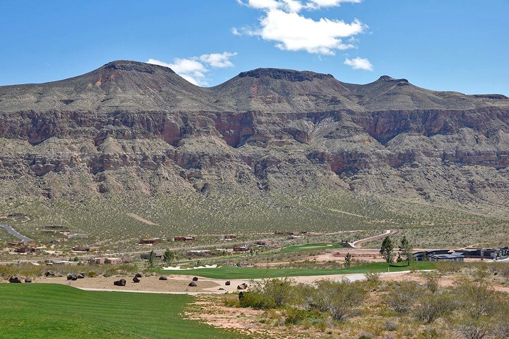 View of the 13th (Down and Dirty) Hole at Copper Rock Golf Course, showcasing the downhill fairway and mountain backdrop