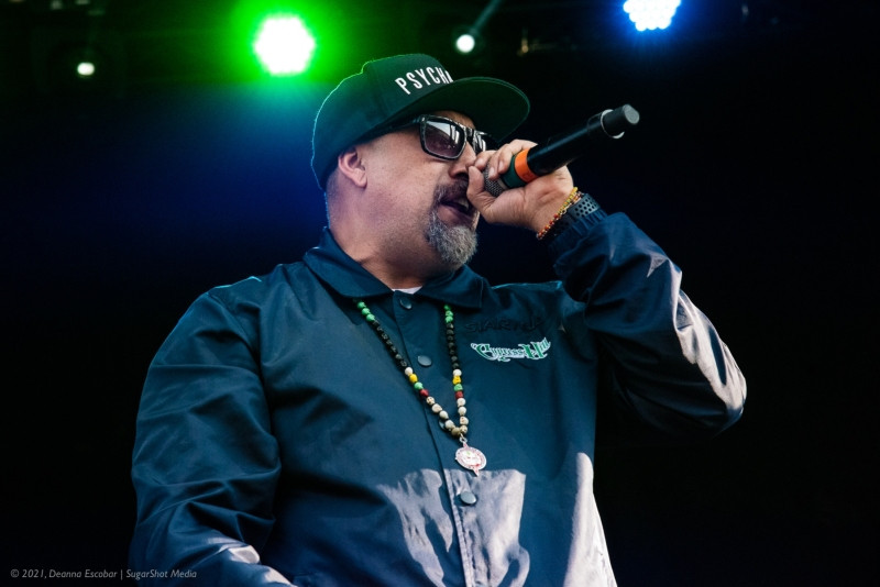 B-Real of Cypress Hill rapping at Blue Ridge Rock Festival Day 3. B-Real is rapping into the microphone during Cypress Hill's performance.