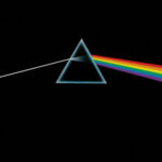 Pink Floyd's Dark Side of the Moon album cover, the iconic prism dispersing light into a rainbow.