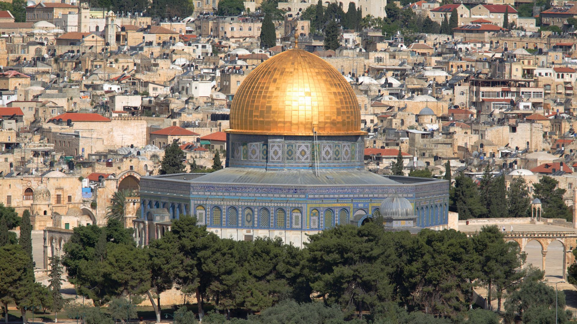 Close up view of the Dome of the Rock's detailed mosaics and Arabic inscriptions, highlighting Byzantine artistic influence.