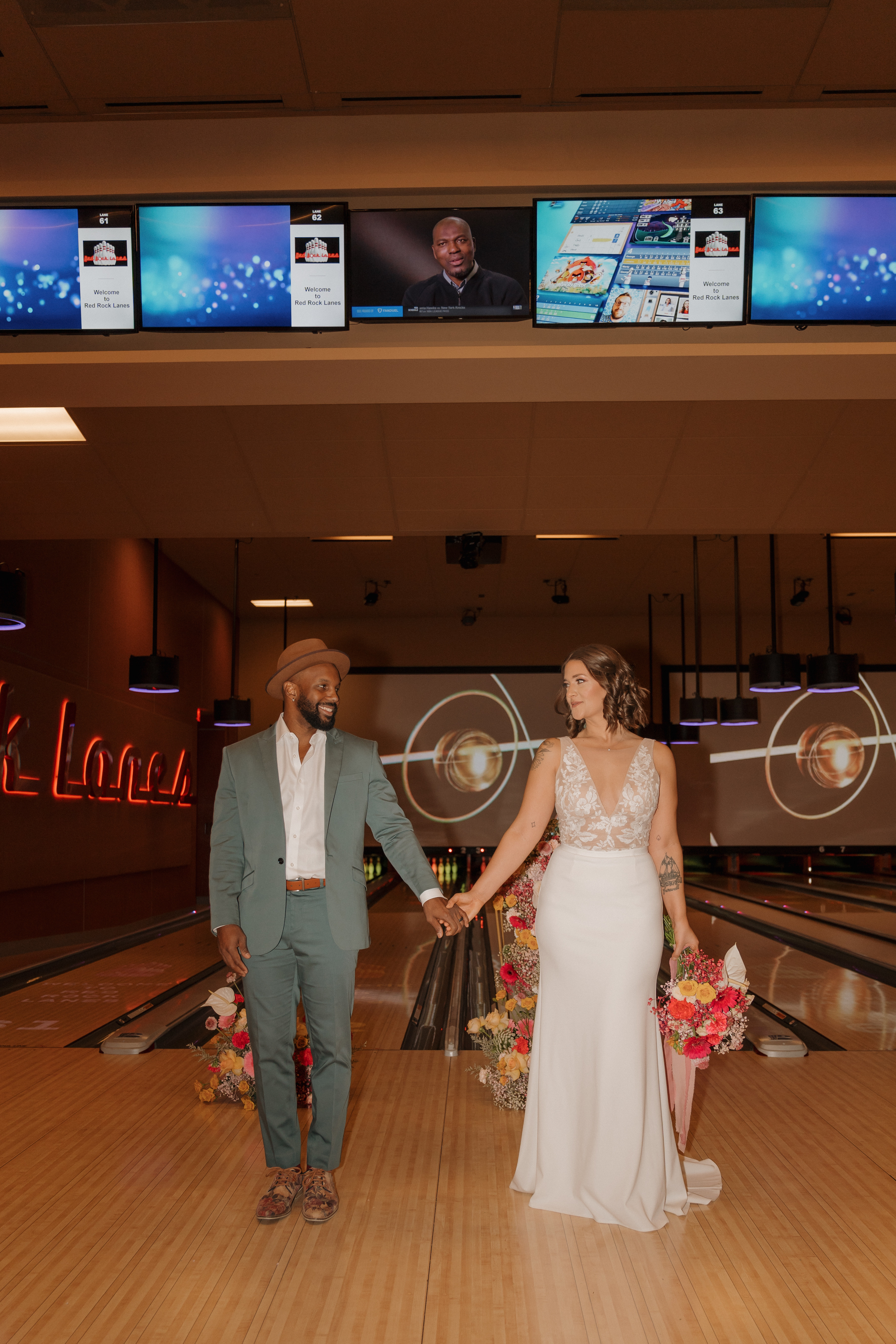 Eloping couple dancing in Red Rock Lanes VIP bowling suite