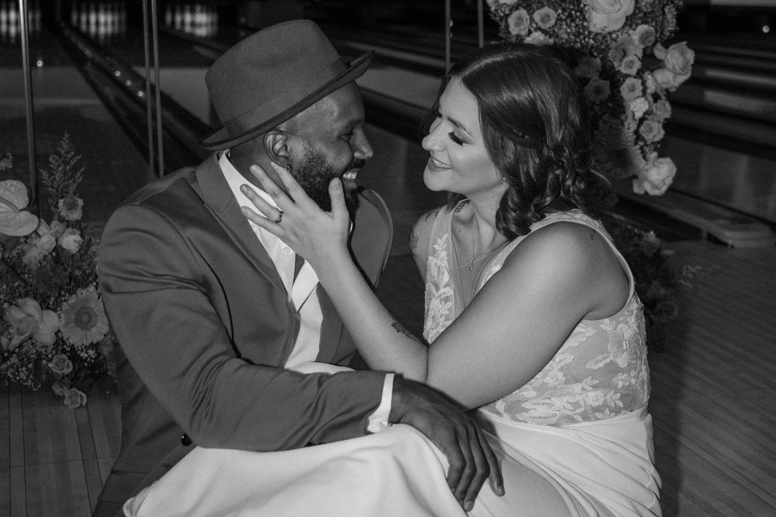 Groom smiling at bride at Red Rock Lanes bowling alley elopement