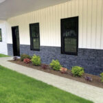 Close up of fake rock siding on a house.