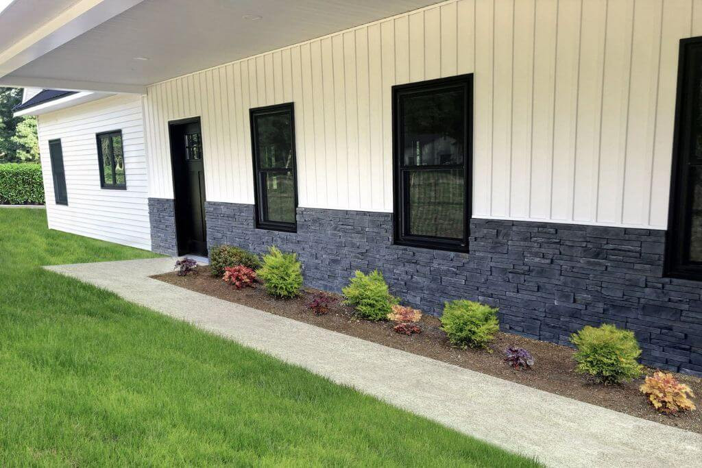 Close up of fake rock siding on a house.