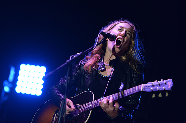 Erika Wennerstrom of The Heartless Bastards performing, alt text: Erika Wennerstrom of The Heartless Bastards, blues-rock vocalist, captivates with her powerful stage presence.