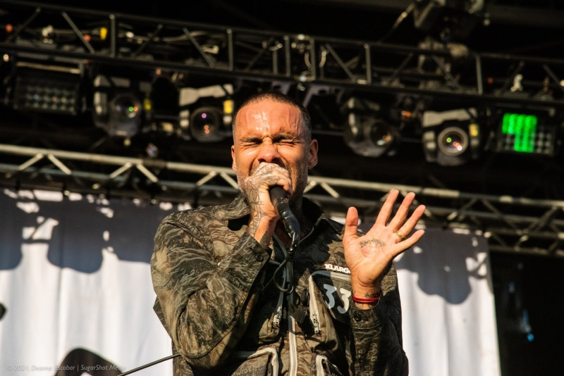 Jason Aalon Butler of Fever 333 performing at Blue Ridge Rock Festival Day 2. The Fever 333 frontman is delivering a high-energy performance on stage.