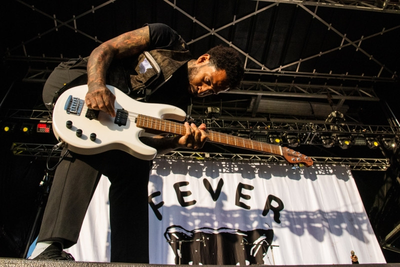 Stephen Harrison of Fever 333 playing guitar at Blue Ridge Rock Festival Day 2. The guitarist is energetically performing on stage during Fever 333's set.