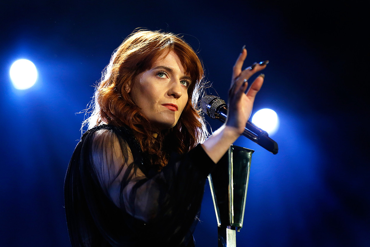 Florence Welch performing with Florence + The Machine